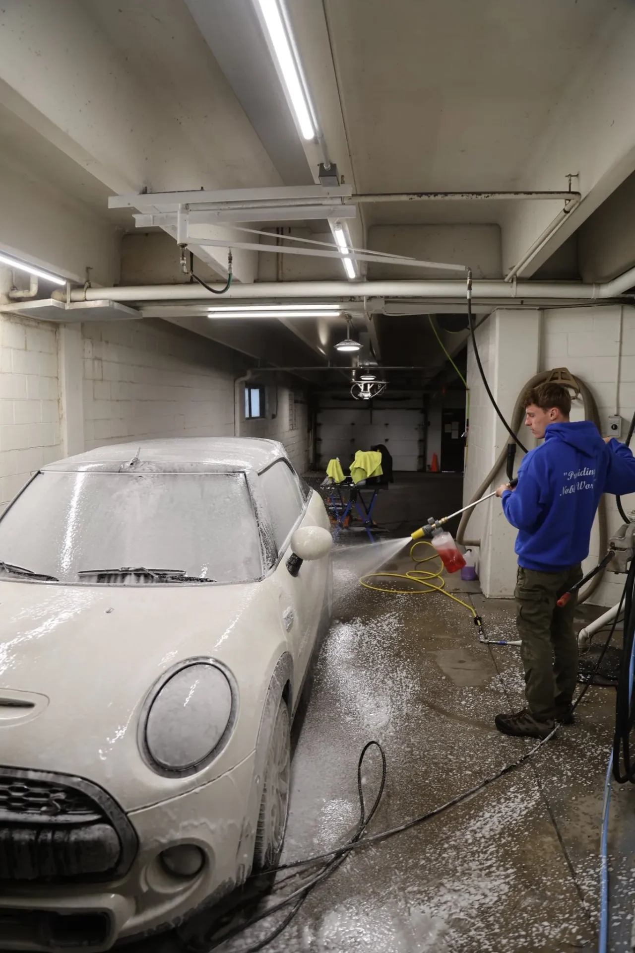 MINI Cooper foam wash in shop bay